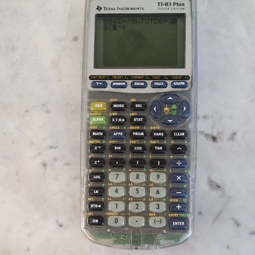 Texas Instruments TI-83 Plus Silver/Clear Graphing Calculator with LCD Display